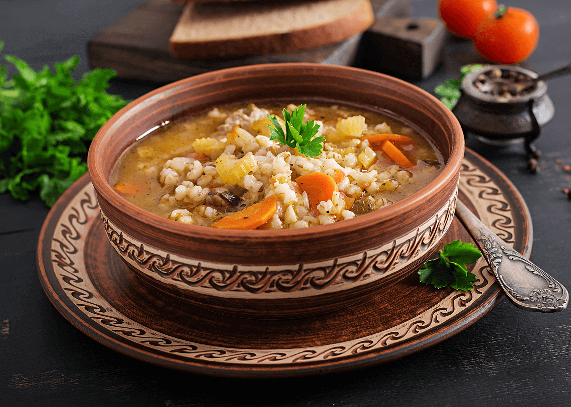 barley-soup-with-carrots-tomato-celery-meat-dark-surface