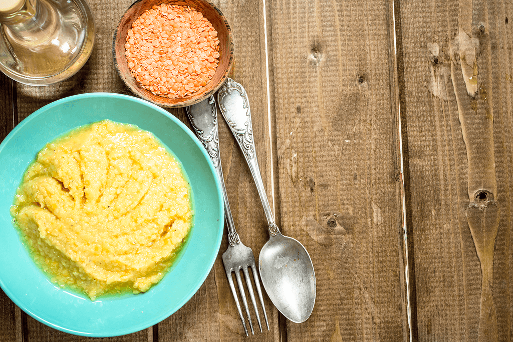 lentil-porridge-with-butter-wooden-table